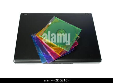 Colored cd`s on a laptop isolated Stock Photo